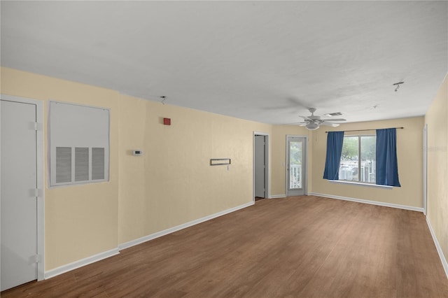 empty room with hardwood / wood-style flooring and ceiling fan