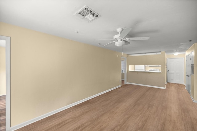 unfurnished room with hardwood / wood-style flooring and ceiling fan