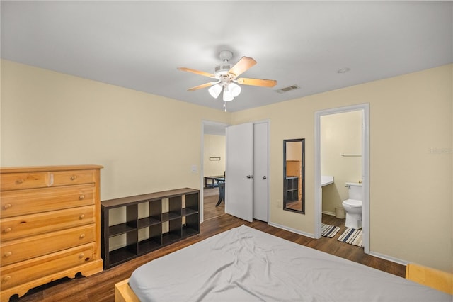 bedroom with dark hardwood / wood-style flooring, connected bathroom, and ceiling fan