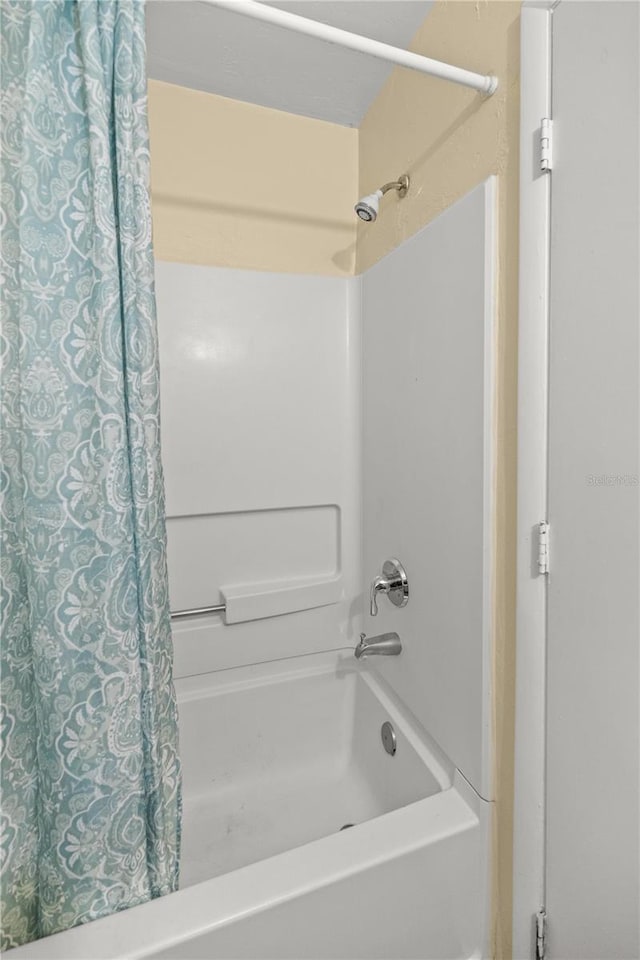 bathroom featuring shower / bath combo with shower curtain