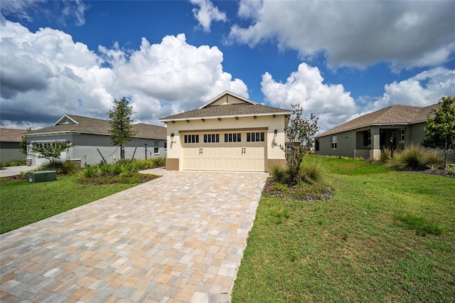 view of front of home with a front lawn and a garage