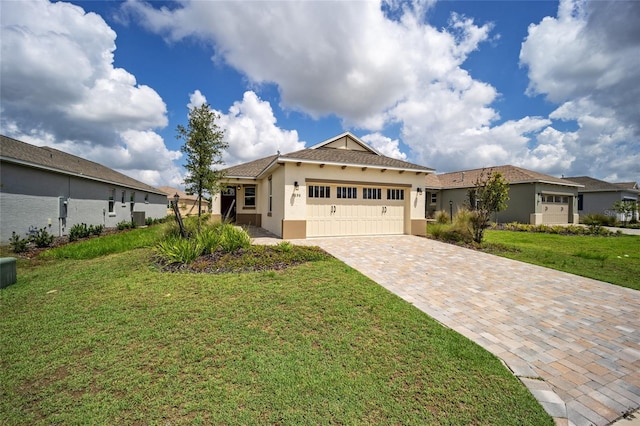 view of front of house featuring a front yard and a garage