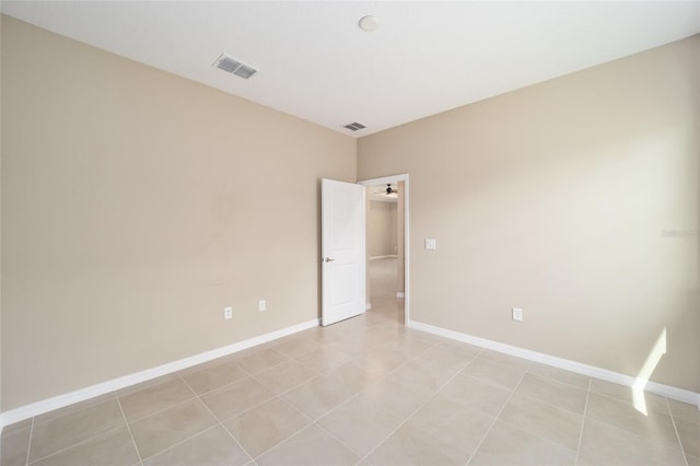 spare room with light tile patterned floors