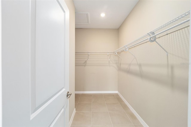 spacious closet with light tile patterned flooring