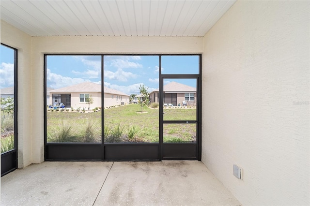 unfurnished sunroom with a healthy amount of sunlight