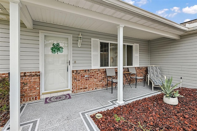 doorway to property featuring a porch