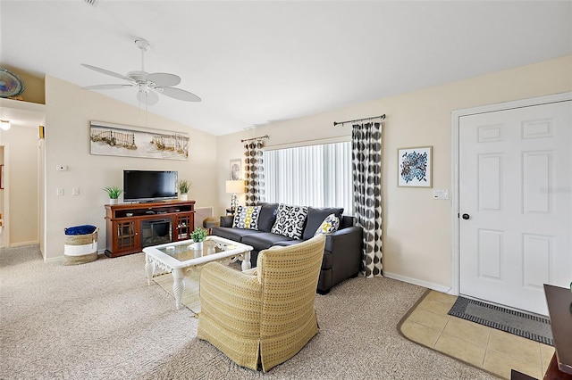 carpeted living room featuring ceiling fan and lofted ceiling