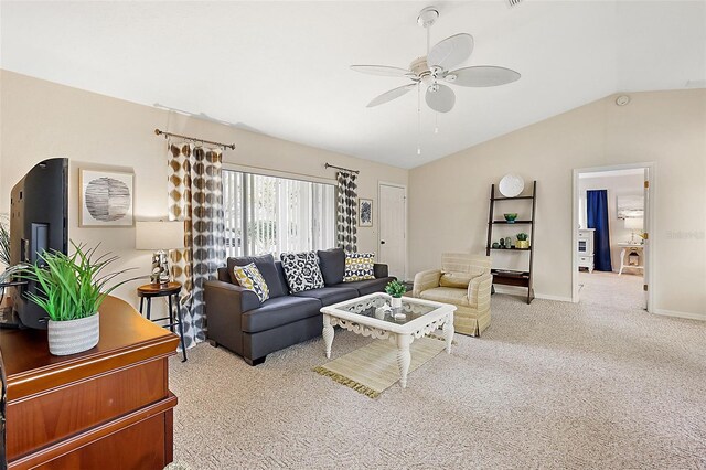 carpeted living room featuring ceiling fan and lofted ceiling