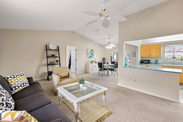 living room with light carpet, ceiling fan, lofted ceiling, and sink