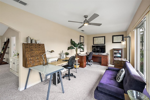 office with light carpet and ceiling fan