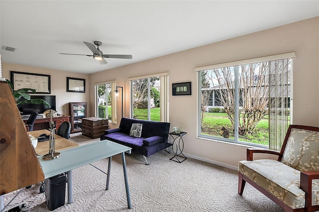 office featuring ceiling fan and light carpet