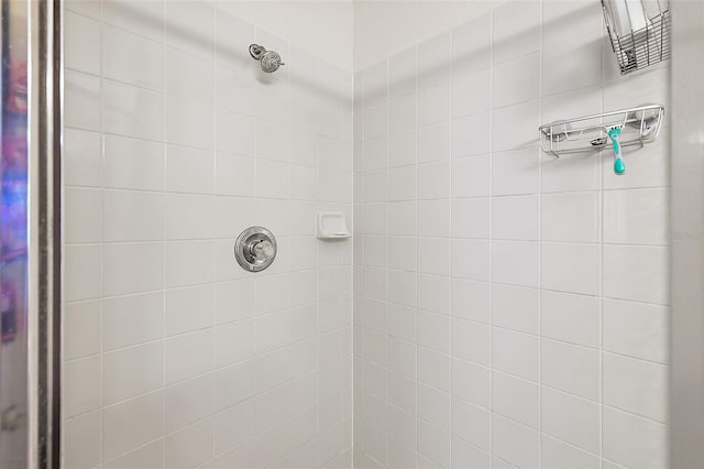 bathroom with tiled shower