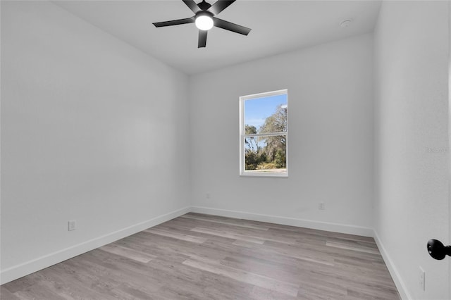 empty room featuring ceiling fan and light hardwood / wood-style flooring