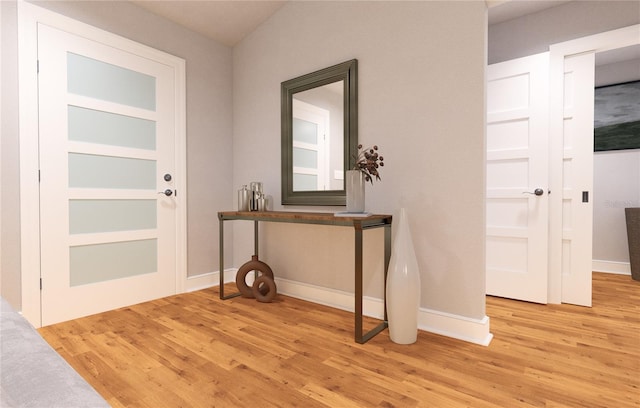 entryway with light hardwood / wood-style flooring