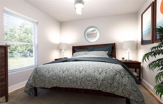 carpeted bedroom with ceiling fan