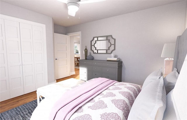 bedroom with a closet, hardwood / wood-style flooring, and ceiling fan