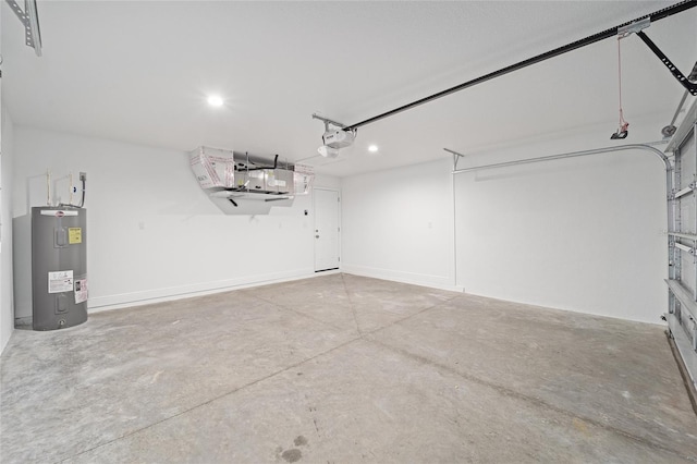 garage featuring water heater and a garage door opener