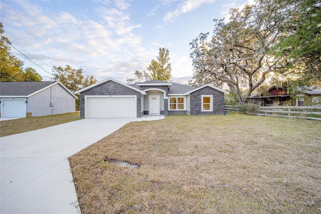 single story home with a garage and a front yard