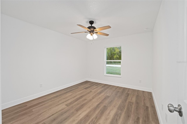 empty room featuring ceiling fan and wood-type flooring