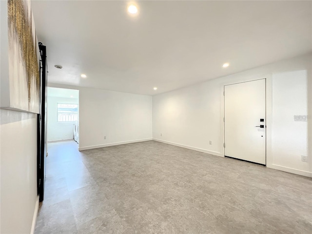 unfurnished room featuring light floors, recessed lighting, and baseboards