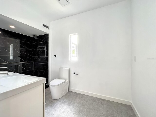 full bathroom with double vanity, visible vents, toilet, concrete floors, and baseboards