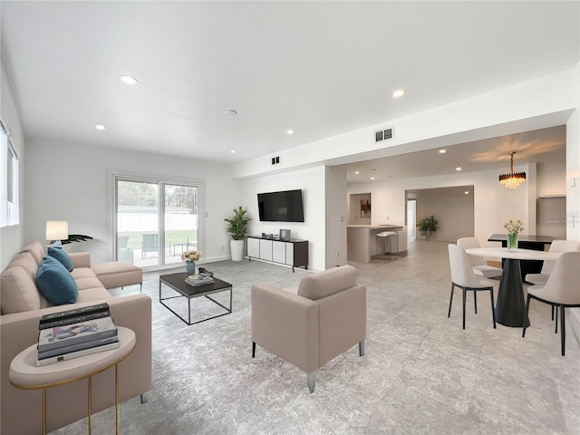 living room featuring visible vents and recessed lighting