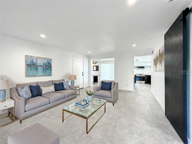 living room featuring recessed lighting and baseboards