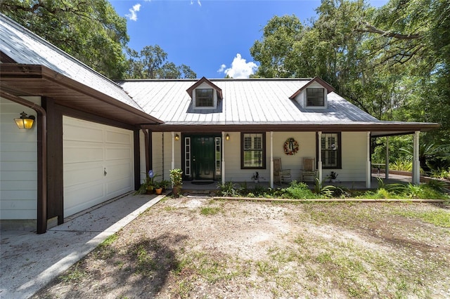 view of front of house with a garage and a porch