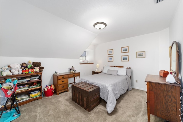 carpeted bedroom with vaulted ceiling