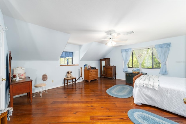 bedroom with ceiling fan, dark hardwood / wood-style flooring, multiple windows, and lofted ceiling