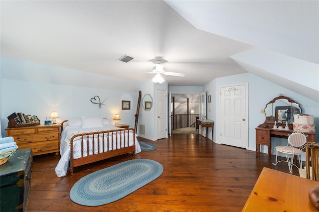 bedroom featuring ceiling fan, vaulted ceiling, and dark hardwood / wood-style flooring