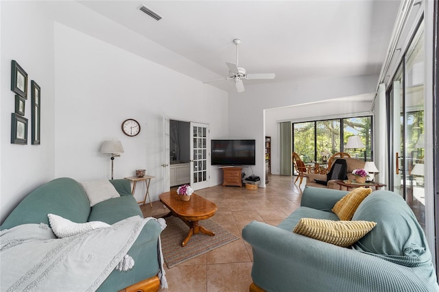 tiled living room featuring ceiling fan