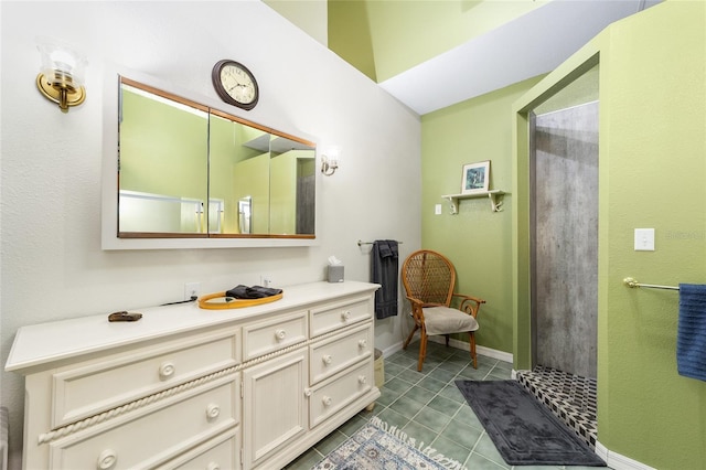 bathroom with tile patterned floors and vanity