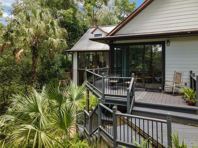 wooden terrace with a sunroom