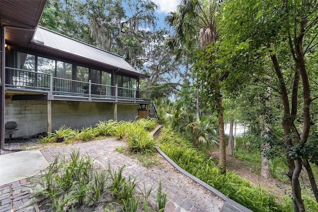 view of yard featuring a sunroom