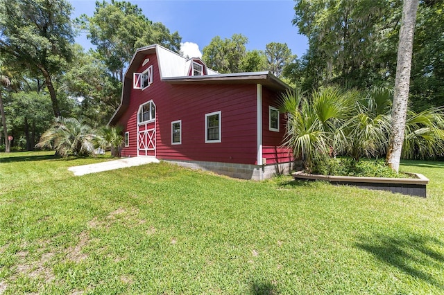 view of home's exterior featuring a lawn