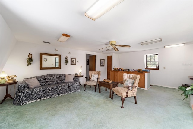 carpeted living room featuring ceiling fan