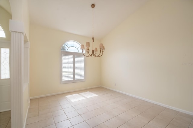 2260 NW 51st Ter, Ocala, FL 34482 - spare room featuring vaulted ceiling, a chandelier, light tile patterned flooring, and baseboards