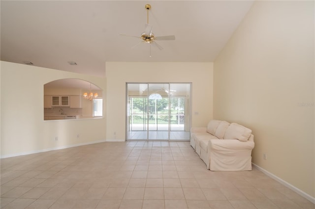 unfurnished room featuring sink, ceiling fan with notable chandelier, and light tile patterned floors