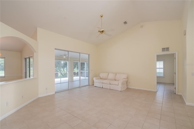 unfurnished room featuring high vaulted ceiling, ceiling fan, and light tile patterned floors