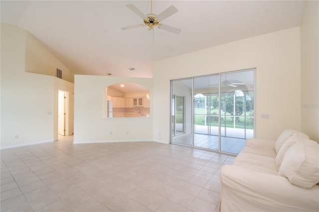 living room with light tile patterned flooring, ceiling fan, and lofted ceiling