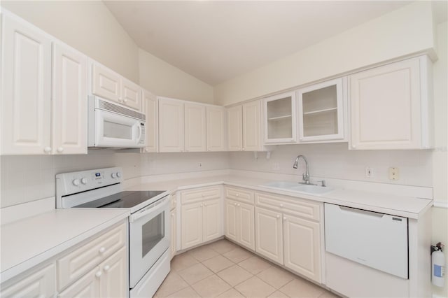 2260 NW 51st Ter, Ocala, FL 34482 - kitchen featuring white appliances, a sink, vaulted ceiling, light countertops, and glass insert cabinets