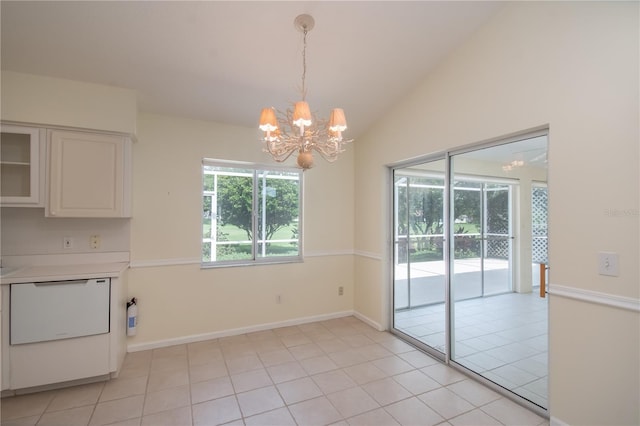 unfurnished dining area featuring a chandelier, lofted ceiling, and light tile patterned floors