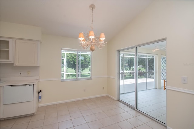 2260 NW 51st Ter, Ocala, FL 34482 - unfurnished dining area with a chandelier, vaulted ceiling, light tile patterned flooring, and baseboards