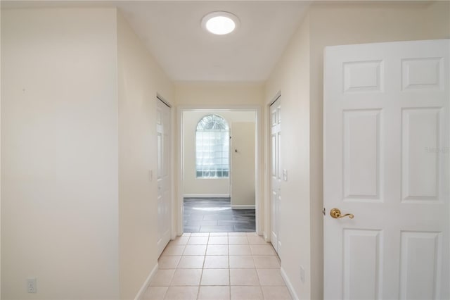 2260 NW 51st Ter, Ocala, FL 34482 - hall featuring light tile patterned floors and baseboards