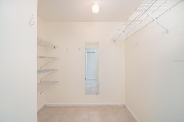 spacious closet with tile patterned floors