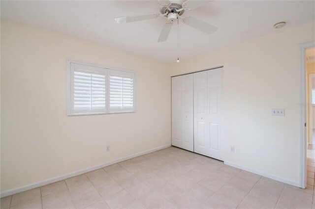 2260 NW 51st Ter, Ocala, FL 34482 - unfurnished bedroom with baseboards, multiple windows, a closet, and a ceiling fan