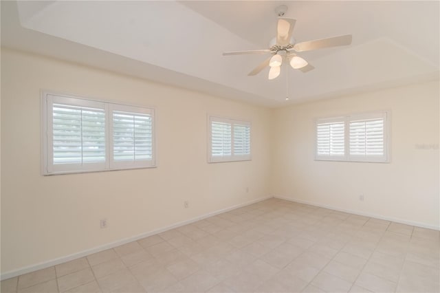 empty room featuring ceiling fan and light tile patterned floors