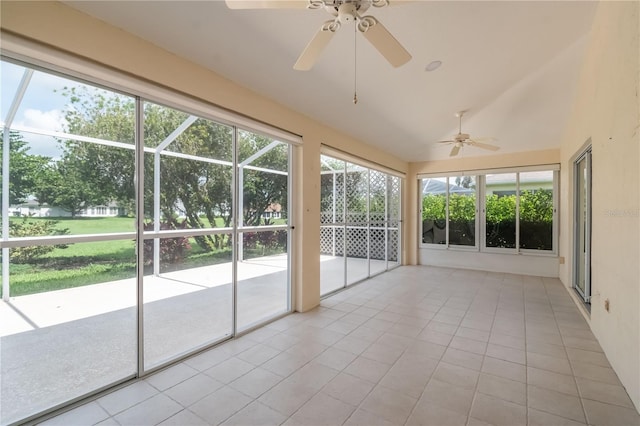 unfurnished sunroom with ceiling fan