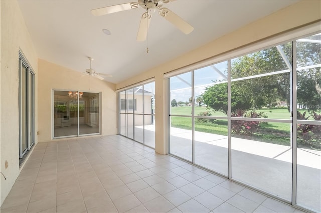 unfurnished sunroom featuring ceiling fan